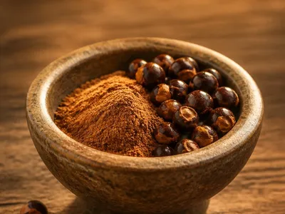 Graines et poudre de guarana dans un bol en pierre
